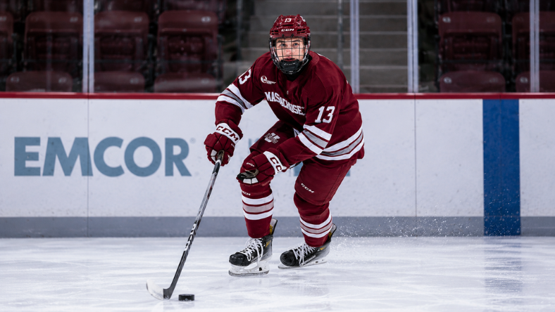 Landon Nycz of UMass controls the puck during a college hockey game ahead of the 2026 NHL Draft.